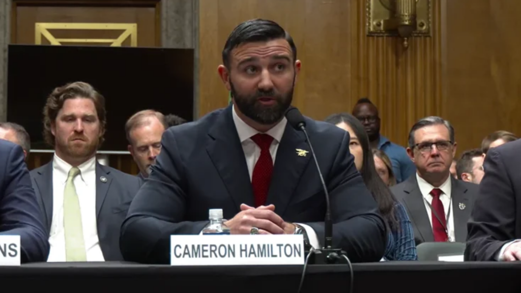 Photo by U.S. Senate Homeland Security and Governmental Affairs Committee | Cameron Hamilton, nominated in May 2026 by President Donald Trump to become Federal Emergency Management Agency administrator, addresses the United States Homeland Security and Governmental Affairs Committee during a June 17, 2026, nominee assessment hearing in Washington, D.C.