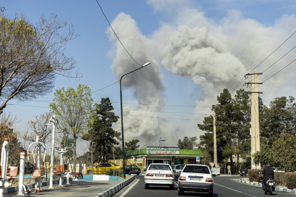 Plumes of smoke rise following an explosion on March 5, 2026 in Tehran, Iran. Democrats in the U.S. Senate on May 27, 2026, asked that the Congressional Budget Office provide the "true costs" of the Iran war. (Photo by Majid Saeedi/Getty Images)