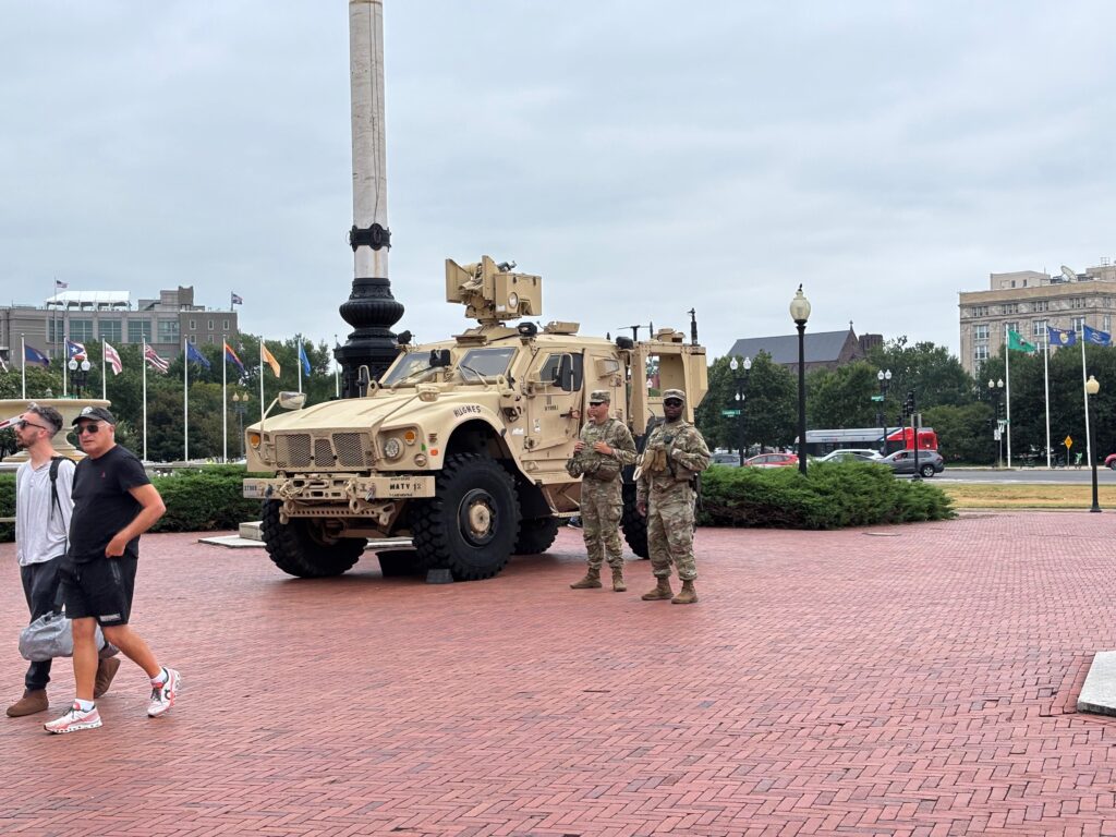 A federal judge on June 5, 2026, struck down several Trump administration policies that halted processing for asylum-seekers following a shooting in Washington, D.C. of two members of the National Guard deployed to the nation's capital. In this photo, tourists pass by members of the guard stationed outside Union Station in Washington, D.C., on Aug. 18, 2025. (Photo by Jane Norman/States Newsroom)