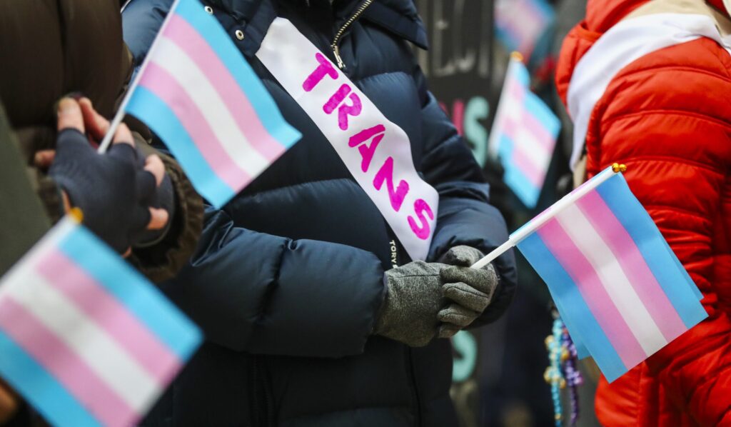 Advocates for transgender rights rallied outside the Statehouse in Trenton, New Jersey, on Jan. 5, 2026, to demand lawmakers pass a bill that would protect gender-affirming care in New Jersey. (Photo by Dana DiFilippo / New Jersey Monitor)