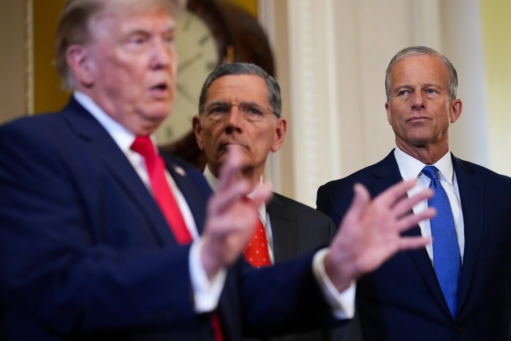 President Donald Trump speaks to the media as U.S. Senate Majority Whip John Barrasso, R-Wyo., and Senate Majority Leader John Thune, R-S.D., look on after a meeting at the U.S. Capitol on June 24, 2026 in Washington, D.C. (Photo by Andrew Harnik/Getty Images)