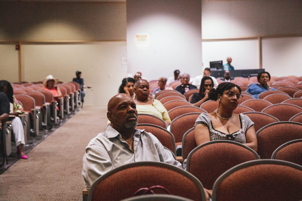 Attendees listen during the commission's June public listening session. (Photo by Marcus Ingram/Virginia Mercury)