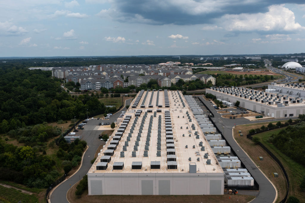 An aerial view shows an Amazon data center in Ashburn, Virginia. PJM Interconnection got the OK from the U.S. Department of Energy to require data centers to turn on back-up generators during this week’s heatwave. (Photo by Nathan Howard/Getty Images)