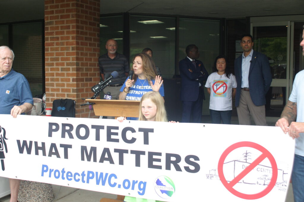 Members of the Coalition to Protect Prince William County rally against the proposed Dulles South data center. (Photo by Shannon Heckt/Virginia Mercury)